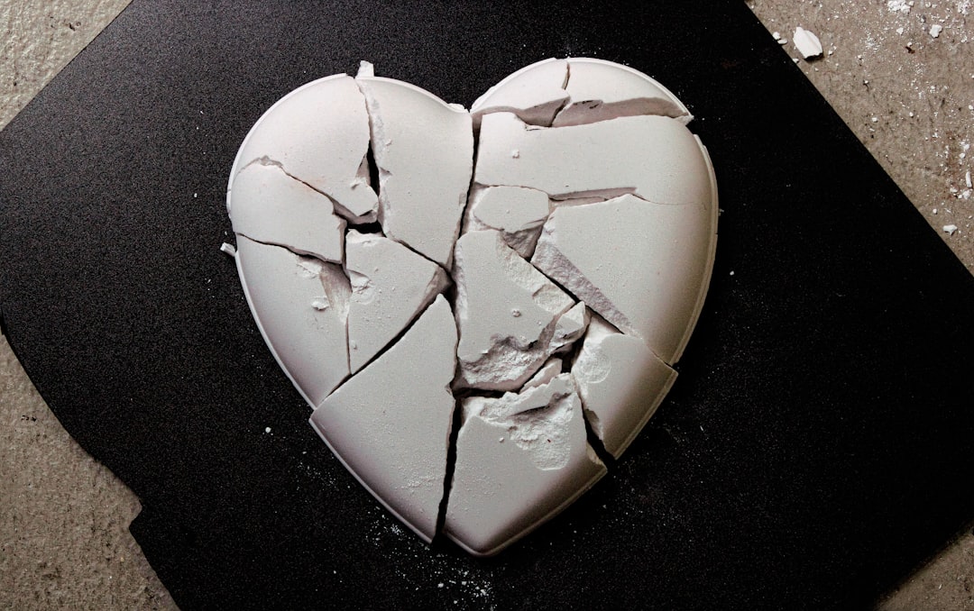 a pink heart cut out of a piece of paper
